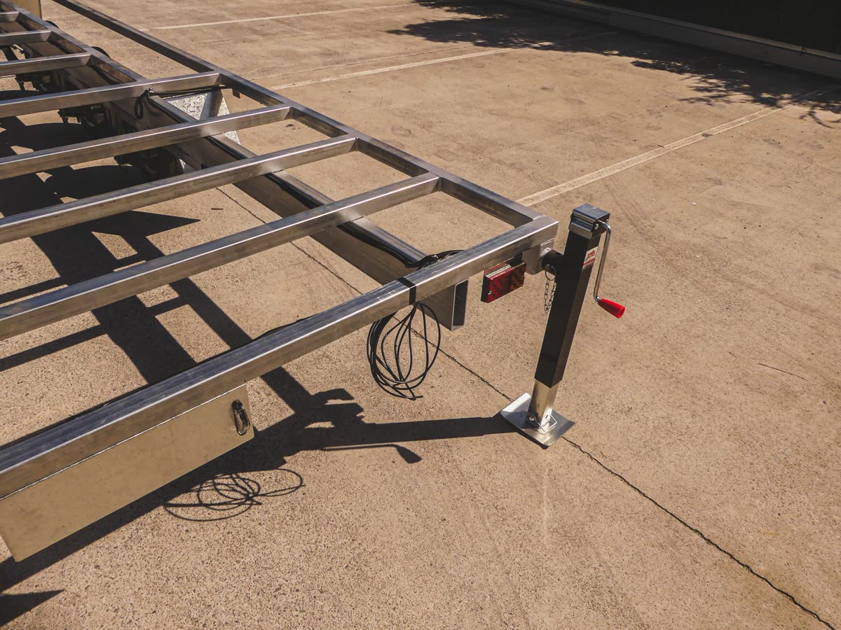 Rover-approved tiny home trailer hitch and safety chains detail